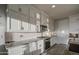 Stylish kitchen features white cabinets, granite countertops, and stainless steel appliances at 8420 S 69Th Ln, Laveen, AZ 85339