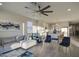 Open-concept living room showcasing a seamless flow between the living area and kitchen at 8420 S 69Th Ln, Laveen, AZ 85339