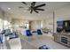 Spacious living space with an open layout showcasing the living room, kitchen and dining area at 8420 S 69Th Ln, Laveen, AZ 85339