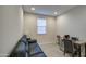 Charming office space featuring a black leather couch, desk, chair, and a window at 8420 S 69Th Ln, Laveen, AZ 85339
