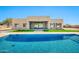 Stunning pool and patio area, ideal for outdoor living with lush landscaping and modern home design at 8730 E Tether Trl, Scottsdale, AZ 85255