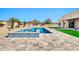 Beautiful pool area featuring a modern design with stone pavers, desert landscaping, and a tranquil setting at 8730 E Tether Trl, Scottsdale, AZ 85255