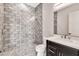 Modern bathroom featuring gray subway tile shower with glass door and dark vanity at 8730 E Tether Trl, Scottsdale, AZ 85255