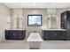 Elegant bathroom showcasing dual vanities, a soaking tub, and a window offering serene views at 8730 E Tether Trl, Scottsdale, AZ 85255