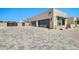 Modern home with a gray driveway, gray garage doors, and a well-manicured landscape at 8730 E Tether Trl, Scottsdale, AZ 85255