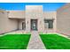 Stunning home with a manicured front lawn and a paved walkway leading to the entrance at 8730 E Tether Trl, Scottsdale, AZ 85255