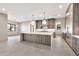 Bright, open-concept kitchen with a large island, stainless steel appliances, and sleek finishes at 8730 E Tether Trl, Scottsdale, AZ 85255