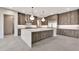Contemporary kitchen featuring a large center island, modern cabinetry, and stainless steel appliances at 8730 E Tether Trl, Scottsdale, AZ 85255