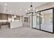 Open-concept living space with a gourmet kitchen, dining area, and a seamless transition to the patio at 8730 E Tether Trl, Scottsdale, AZ 85255