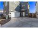 Two-story gray home with a white garage door and concrete driveway at 1017 E Odeum Ln, Phoenix, AZ 85040