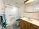 Bathroom featuring a shower and tub combination with safety bars and updated fixtures at 10330 W Thunderbird Blvd # C128, Sun City, AZ 85351