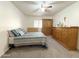 Comfortable bedroom features a ceiling fan, window, and matching dresser and wardrobe set at 10330 W Thunderbird Blvd # C128, Sun City, AZ 85351