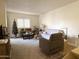 Bright living room with ample seating, natural light, and a cozy atmosphere at 10330 W Thunderbird Blvd # C128, Sun City, AZ 85351