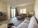 Cozy living room filled with natural light, a comfortable sofa, and stylish decor at 10330 W Thunderbird Blvd # C128, Sun City, AZ 85351