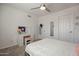 Bright bedroom with a vanity, ample closet space, and a comfortable bed at 10490 E Dreyfus E Ave, Scottsdale, AZ 85260