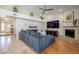 Comfortable living room offering lots of seating, a fireplace and high ceilings at 10490 E Dreyfus E Ave, Scottsdale, AZ 85260