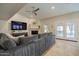 Inviting living room featuring a fireplace, TV, and access to outdoor patio area at 10490 E Dreyfus E Ave, Scottsdale, AZ 85260