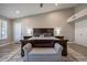Comfortable main bedroom featuring neutral colored walls, wood-look floors, and natural lighting at 10490 E Dreyfus E Ave, Scottsdale, AZ 85260