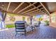 Outdoor patio featuring comfortable seating, manicured lawn, and a sparkling pool view at 10490 E Dreyfus E Ave, Scottsdale, AZ 85260