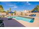 Gorgeous swimming pool with lounge chairs and umbrellas, perfect for enjoying the outdoors at 10490 E Dreyfus E Ave, Scottsdale, AZ 85260