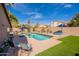 Lush backyard features a refreshing pool, perfect for relaxing and enjoying the outdoors at 10490 E Dreyfus E Ave, Scottsdale, AZ 85260