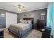 Comfortable bedroom with a decorative ceiling fan and a calming grey color scheme at 11011 N Coggins Dr, Sun City, AZ 85351