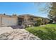 A beautiful, single-story home with an attached garage and inviting curb appeal at 11011 N Coggins Dr, Sun City, AZ 85351