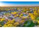 Panoramic aerial view showcasing the property, swimming pool, desert landscaping, and surrounding neighborhood at sunset at 11801 N Sundown Dr, Scottsdale, AZ 85260