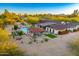 Expansive property with a luxurious pool, covered outdoor living space, and beautifully landscaped grounds at 11801 N Sundown Dr, Scottsdale, AZ 85260