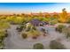 Bird's eye view of a circular driveway leading to the property with desert landscaping and mountain views at 11801 N Sundown Dr, Scottsdale, AZ 85260