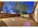 Backyard yoga area with stone accents, desert foliage, privacy walls, and a pebble floor at 11801 N Sundown Dr, Scottsdale, AZ 85260