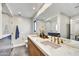 Modern bathroom featuring double sinks with a marble countertop and a sleek, glass-enclosed shower at 11801 N Sundown Dr, Scottsdale, AZ 85260