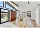 Light filled main bedroom offering wood floors, a ceiling fan, seating, and outside views at 11801 N Sundown Dr, Scottsdale, AZ 85260
