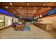Covered outdoor area with a bar, seating, and view of the pool and backyard at 11801 N Sundown Dr, Scottsdale, AZ 85260
