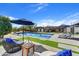 Inviting pool with patio, umbrellas, and lounge seating perfect for relaxation and outdoor entertainment at 11801 N Sundown Dr, Scottsdale, AZ 85260