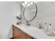 Chic powder room with marble countertop, vessel sink, and modern lighting fixture at 11801 N Sundown Dr, Scottsdale, AZ 85260