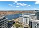 Amazing aerial view of high-rise condos beside a lake and city, showcasing nearby scenic mountains at 120 E Rio Salado Pkwy # 101, Tempe, AZ 85281