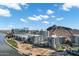 Wide aerial shot of the complex and lake, set against a beautiful, sunny skyscape and mountain backdrop at 120 E Rio Salado Pkwy # 101, Tempe, AZ 85281
