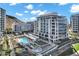 High angle shot of the complex, pool, hot tub, table tennis, landscaping and neighboring office buildings at 120 E Rio Salado Pkwy # 101, Tempe, AZ 85281