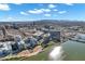 Panoramic aerial view of Tempe condos with a pool by Tempe Town Lake and Papago Mountains at 120 E Rio Salado Pkwy # 101, Tempe, AZ 85281