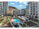 High angle shot of the complex, pool, hot tub, table tennis, landscaping and neighboring office buildings at 120 E Rio Salado Pkwy # 101, Tempe, AZ 85281