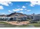 Stunning aerial view of modern condo buildings near a lake and mountain under a blue sky at 120 E Rio Salado Pkwy # 101, Tempe, AZ 85281