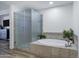 This bathroom offers a bathtub with shower and frosted glass at 120 E Rio Salado Pkwy # 101, Tempe, AZ 85281