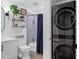 Stylish bathroom features floating shelves, modern fixtures, and stacked washer and dryer units at 120 E Rio Salado Pkwy # 101, Tempe, AZ 85281