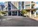 Modern building with a glass-covered entryway, beautiful foliage, and red brick pedestrian area at 120 E Rio Salado Pkwy # 101, Tempe, AZ 85281