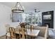 Bright dining area features a wooden table and chairs, chandelier, and views from the window at 120 E Rio Salado Pkwy # 101, Tempe, AZ 85281