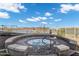 A bubbly outdoor hot tub surrounded by stone pavers, set against a beautiful, sunny skyscape at 120 E Rio Salado Pkwy # 101, Tempe, AZ 85281