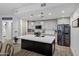 Modern kitchen featuring a white marble island, gray cabinets, stainless steel appliances, and modern lighting at 120 E Rio Salado Pkwy # 101, Tempe, AZ 85281