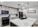 Contemporary kitchen with white marble island, gray cabinetry, stainless steel appliances, and modern pendant lighting at 120 E Rio Salado Pkwy # 101, Tempe, AZ 85281