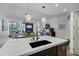 Kitchen island features marble countertops, black sink, and pendant lighting at 120 E Rio Salado Pkwy # 101, Tempe, AZ 85281